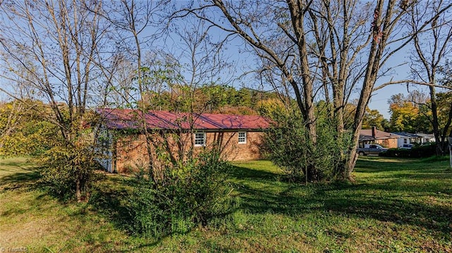 view of property exterior featuring a lawn