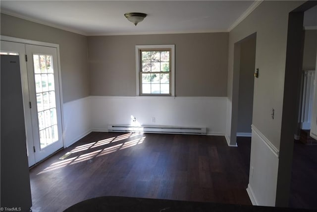 unfurnished room featuring dark hardwood / wood-style flooring, a baseboard radiator, and ornamental molding