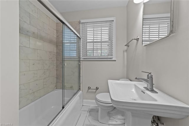1810 Elm St N, Greensboro, NC 27408 - bathroom with marble look tiles and shower / bath combination with glass door