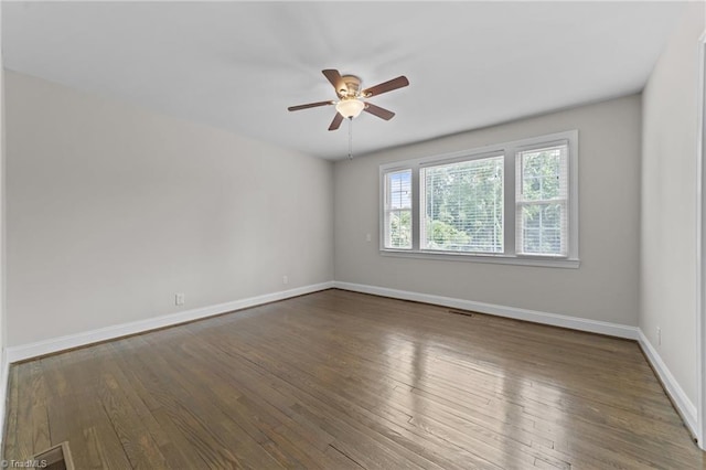 1810 Elm St N, Greensboro, NC 27408 - spare room with a ceiling fan and wood finished floors