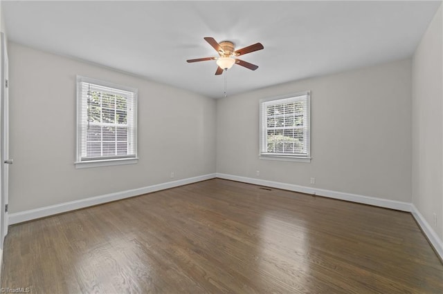 1810 Elm St N, Greensboro, NC 27408 - empty room featuring a ceiling fan and dark wood-style floors