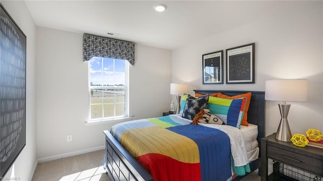 bedroom featuring light carpet