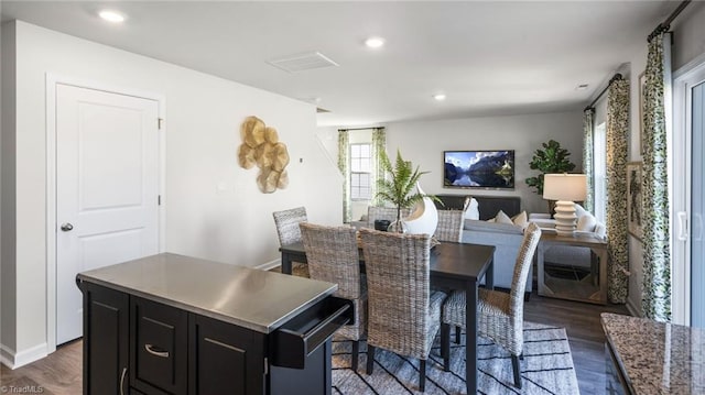 dining space featuring dark hardwood / wood-style flooring