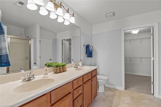 full bath with double vanity, a stall shower, visible vents, and a sink