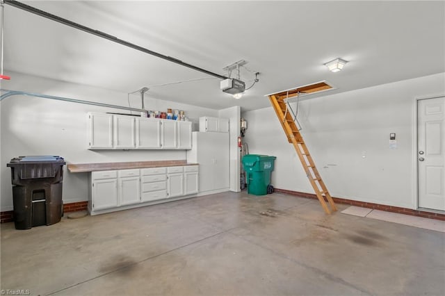 garage featuring baseboards and a garage door opener