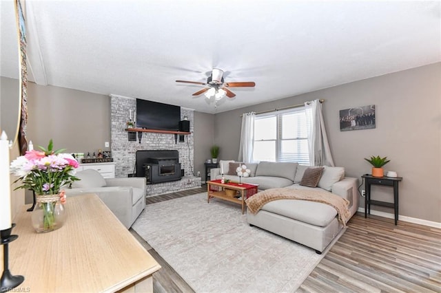 living room with ceiling fan and hardwood / wood-style floors