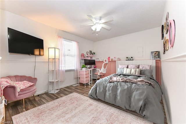 bedroom featuring ceiling fan and dark hardwood / wood-style flooring