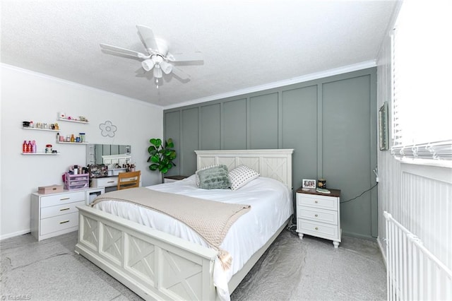 bedroom with ceiling fan and crown molding