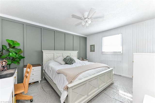 bedroom featuring ceiling fan and crown molding