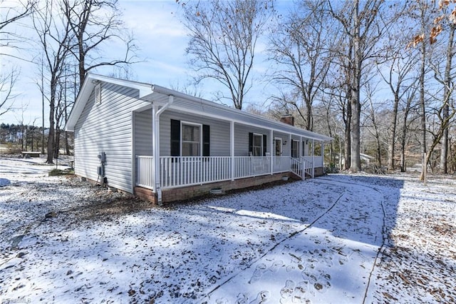 ranch-style house featuring a porch