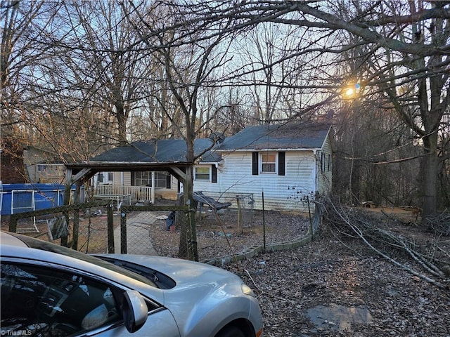 view of front facade featuring fence