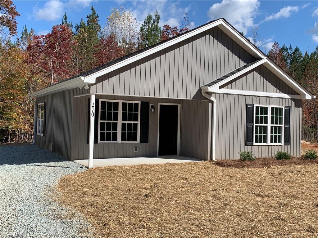 view of front of home featuring board and batten siding and a patio area