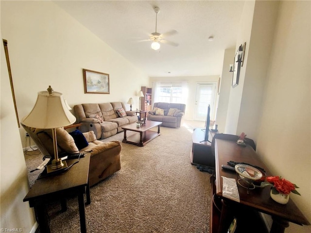 carpeted living room featuring lofted ceiling and ceiling fan