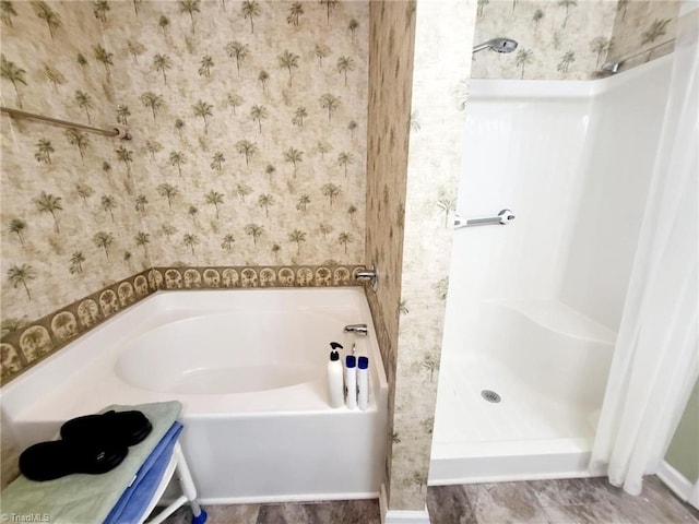 bathroom with shower with separate bathtub