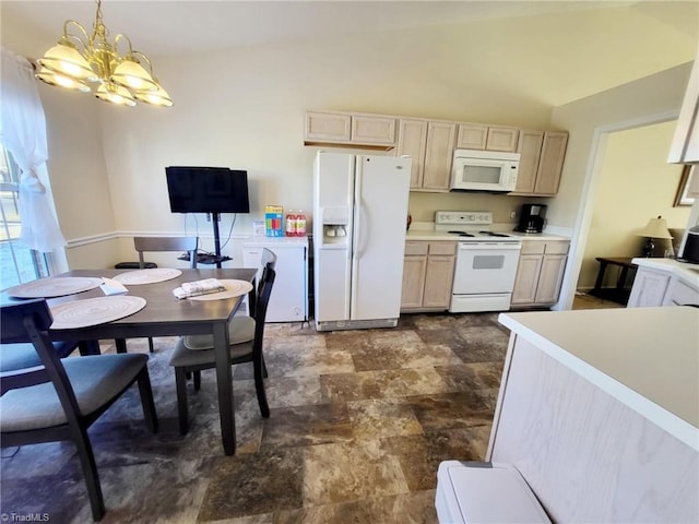 kitchen featuring light brown cabinets, white appliances, hanging light fixtures, and a notable chandelier