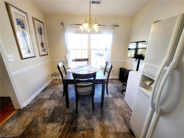 dining room featuring a notable chandelier