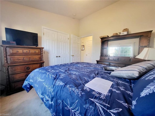 carpeted bedroom with a closet