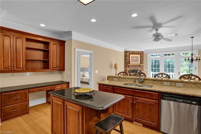 kitchen with sink, a kitchen island, dishwasher, light wood-type flooring, and crown molding