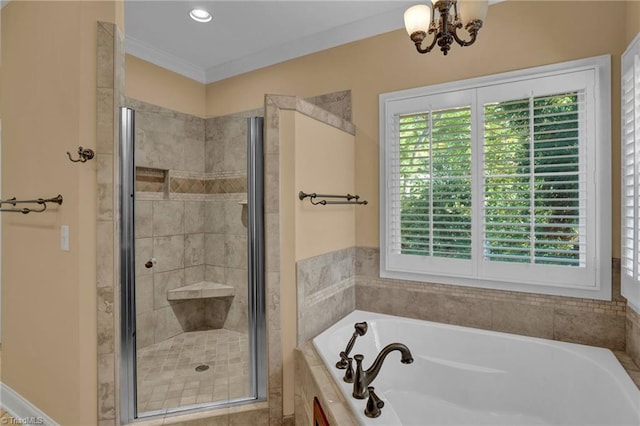 full bath with a garden tub, a chandelier, ornamental molding, and a stall shower