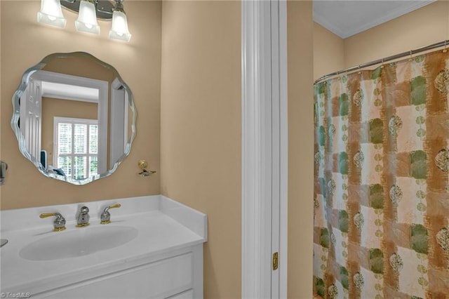 full bath with ornamental molding, vanity, and a shower with shower curtain