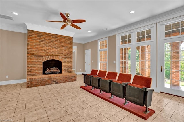 living room featuring a brick fireplace, ornamental molding, light tile patterned floors, and ceiling fan