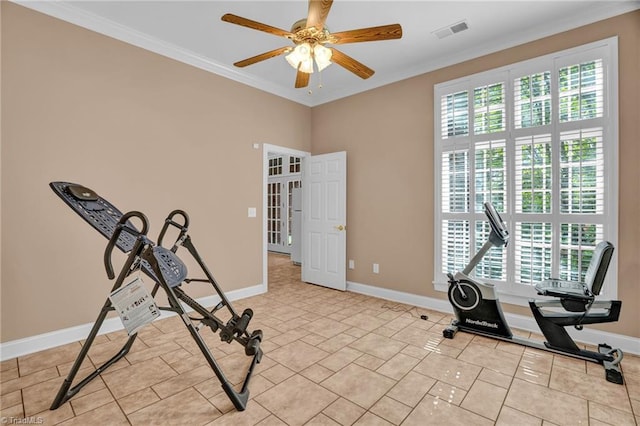 exercise area with baseboards, visible vents, ceiling fan, and crown molding