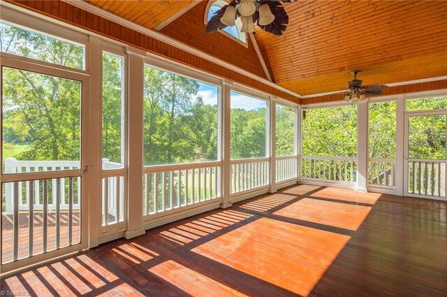 unfurnished sunroom with lofted ceiling, a healthy amount of sunlight, and ceiling fan