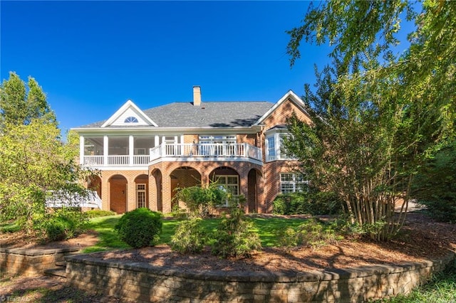 view of front of house with a balcony