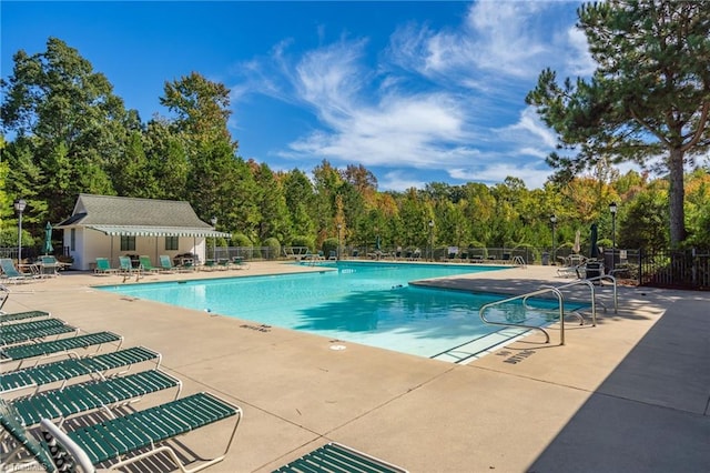 view of swimming pool featuring a patio