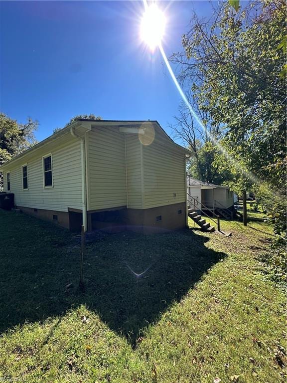 view of property exterior featuring a yard