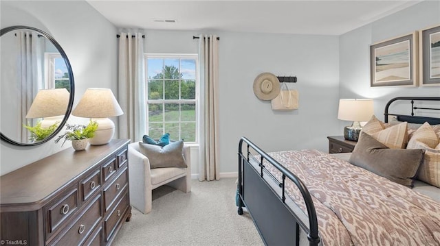 bedroom featuring light colored carpet