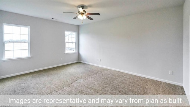 carpeted spare room with ceiling fan