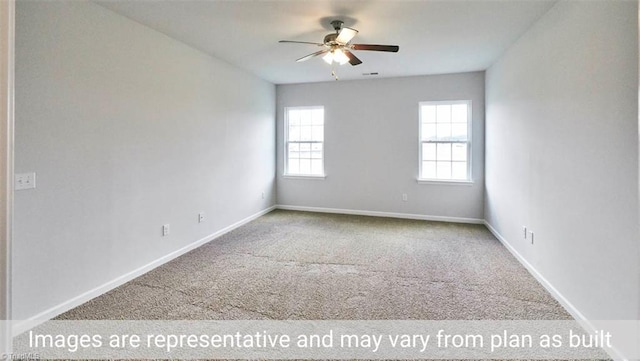 carpeted spare room with ceiling fan