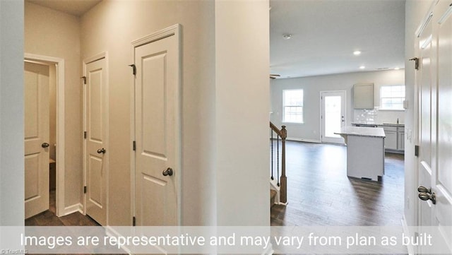 hallway with dark wood-type flooring