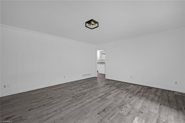 2104 Laura Ln, High Point, NC 27262 - spare room with wood finished floors, baseboards, and crown molding