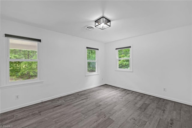 2104 Laura Ln, High Point, NC 27262 - unfurnished room featuring wood finished floors and baseboards