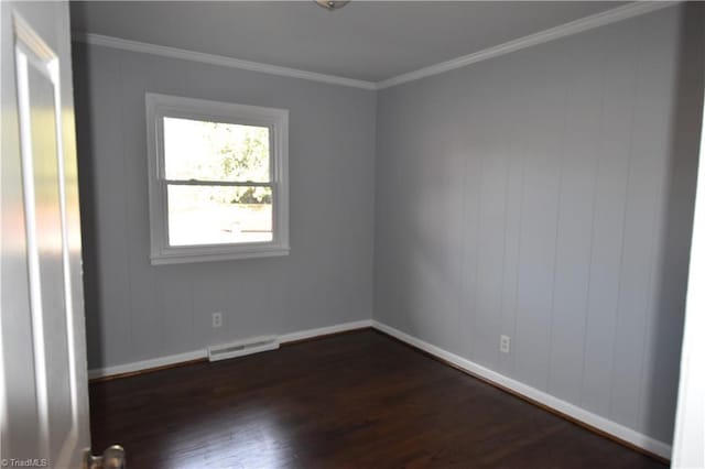 unfurnished room with dark hardwood / wood-style floors and crown molding