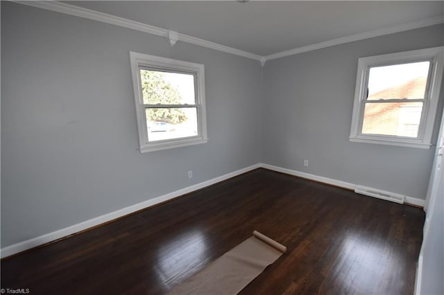 spare room with ornamental molding and dark wood-type flooring