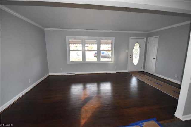 foyer entrance with dark hardwood / wood-style flooring and crown molding