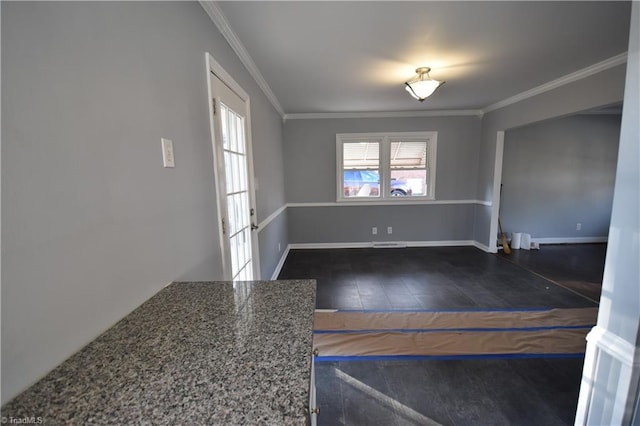 unfurnished room featuring ornamental molding