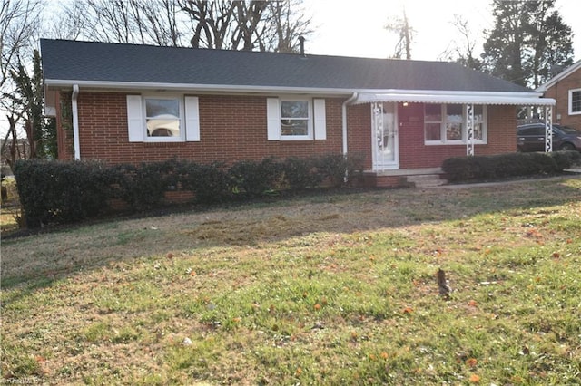 ranch-style home with a front lawn