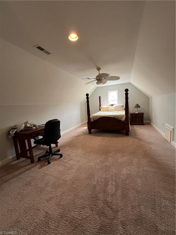 unfurnished bedroom featuring visible vents, carpet flooring, baseboards, and lofted ceiling