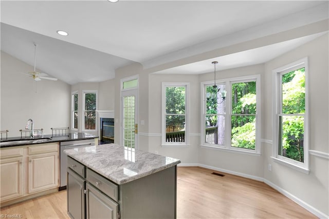 4507 Brandt Ridge Dr, Greensboro, NC 27455 - kitchen featuring stainless steel dishwasher, plenty of natural light, and a sink