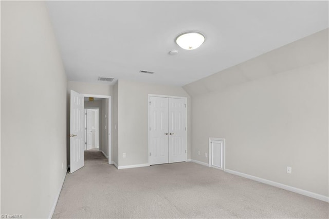 4507 Brandt Ridge Dr, Greensboro, NC 27455 - unfurnished bedroom with visible vents, baseboards, a closet, and light colored carpet