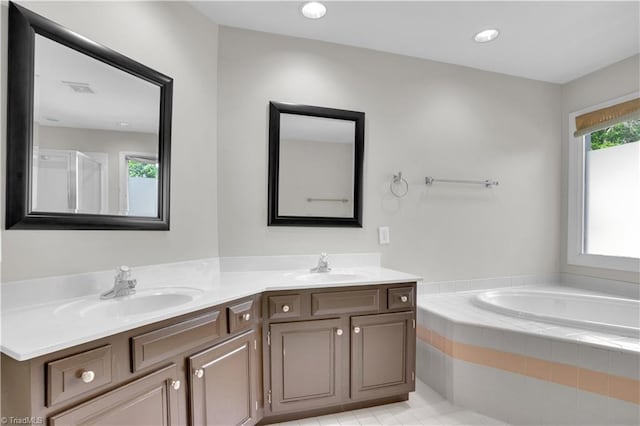 4507 Brandt Ridge Dr, Greensboro, NC 27455 - full bath featuring double vanity, a sink, a bath, and visible vents