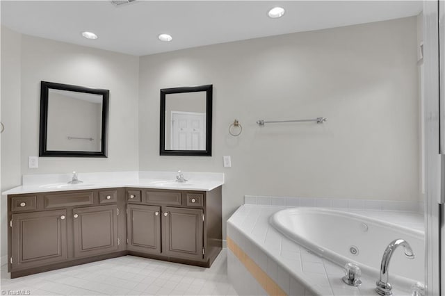 4507 Brandt Ridge Dr, Greensboro, NC 27455 - full bathroom featuring double vanity, tile patterned floors, a tub with jets, and a sink