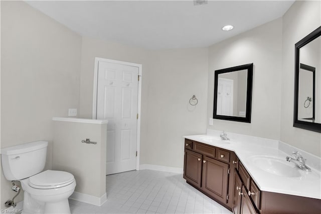4507 Brandt Ridge Dr, Greensboro, NC 27455 - bathroom with a sink, tile patterned floors, baseboards, and toilet