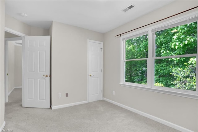 4507 Brandt Ridge Dr, Greensboro, NC 27455 - unfurnished bedroom featuring baseboards, light colored carpet, and visible vents