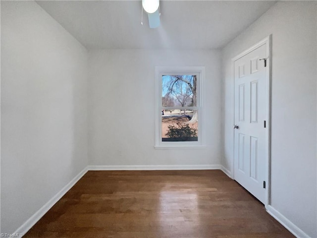 empty room with dark wood-type flooring