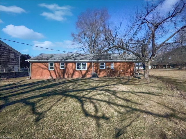 back of house with a yard